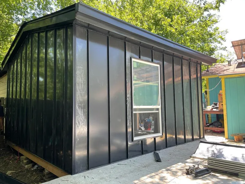 Black standing seam metal wall panels for Roof Inspection in University Place